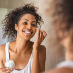 Woman applying moisturizer during a sensitive skin routine