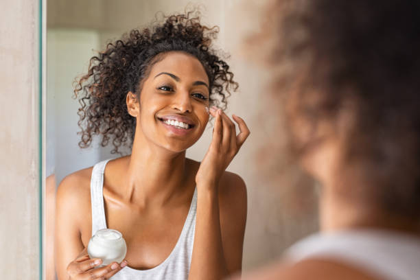 Woman applying moisturizer during a sensitive skin routine