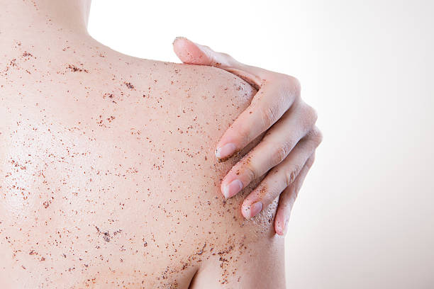 Person receiving a back exfoliation treatment